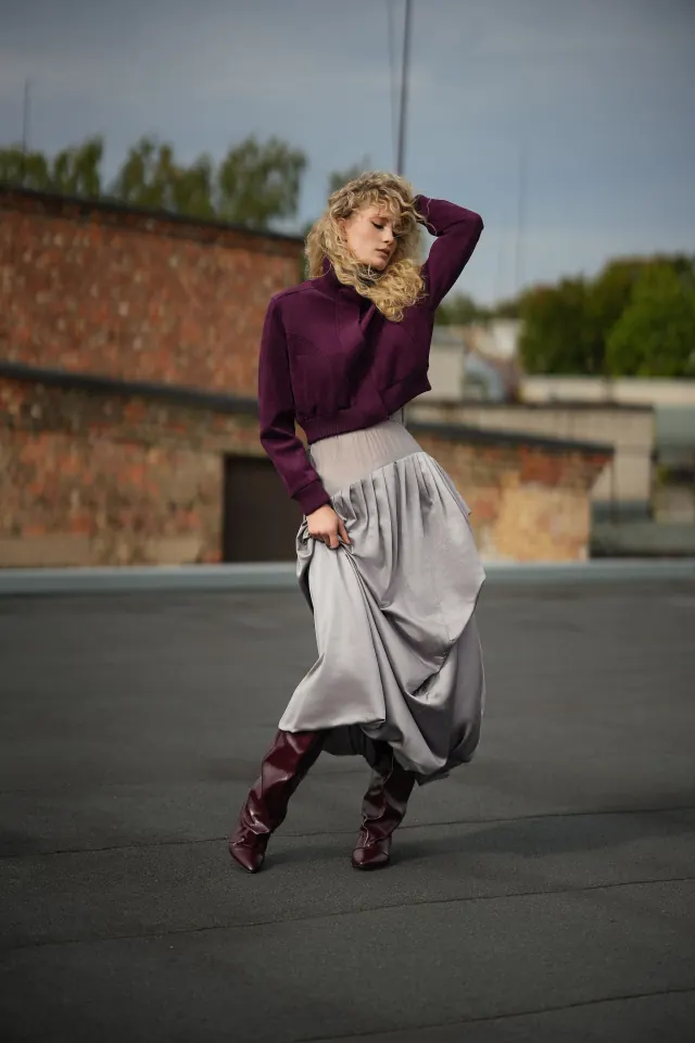 FOXXY burgundy knee-high boots styled with a plum jacket and silver dress